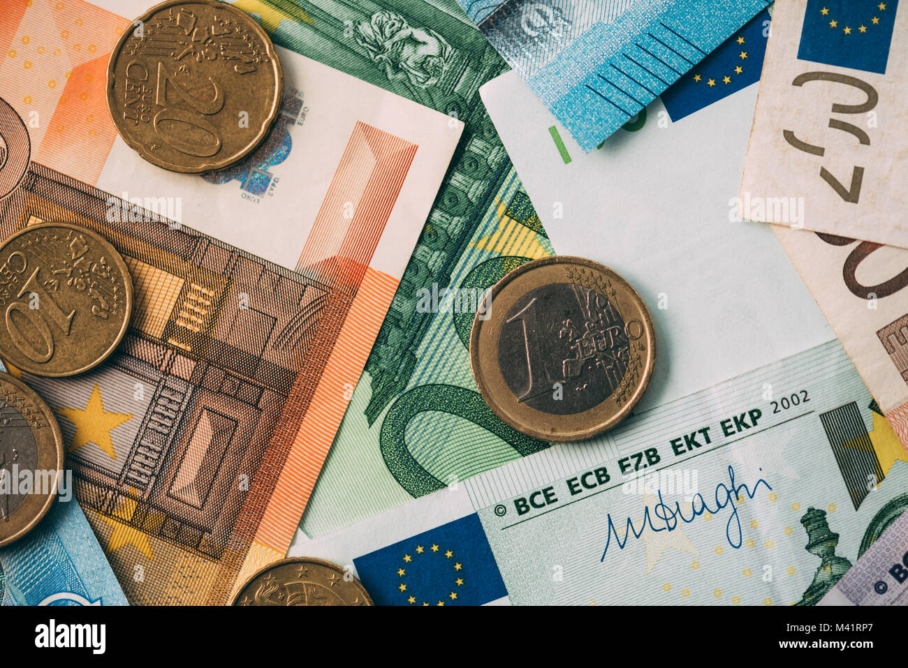 Euro coins on cash stack closeup Stock Photo