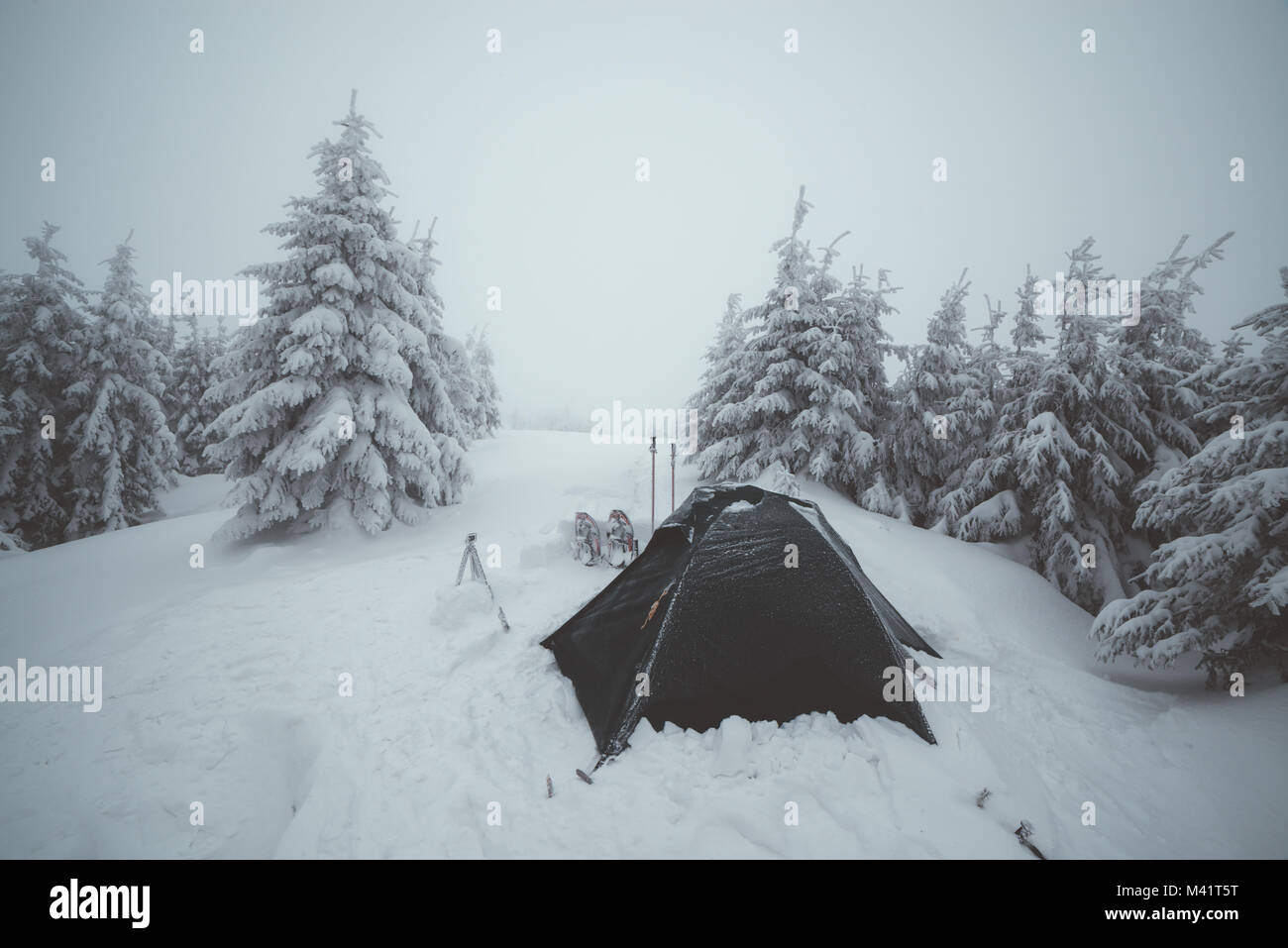 Frozen tents in the high mountain Stock Photo