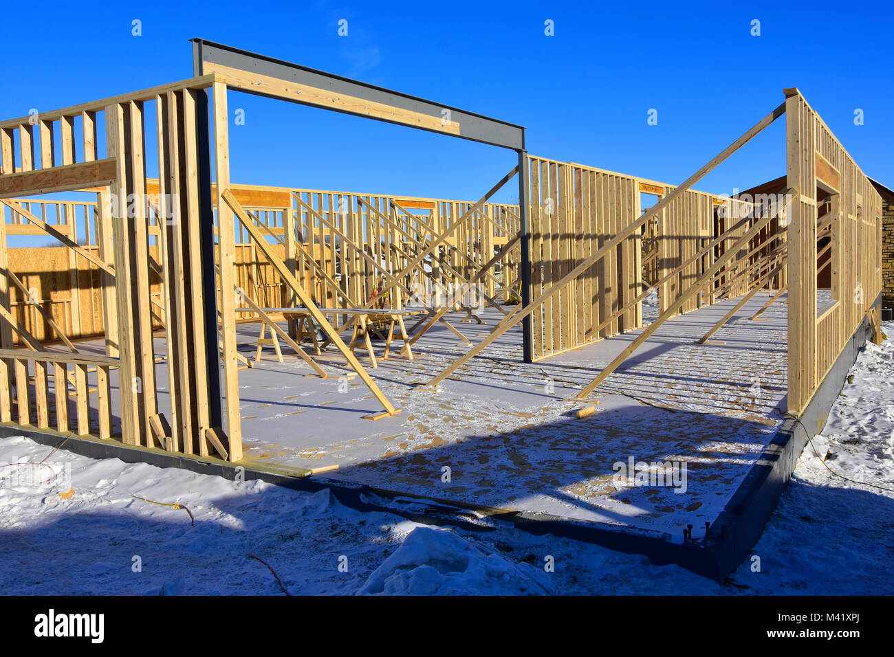Concrete and wood frame commercial building under construction. Stock Photo