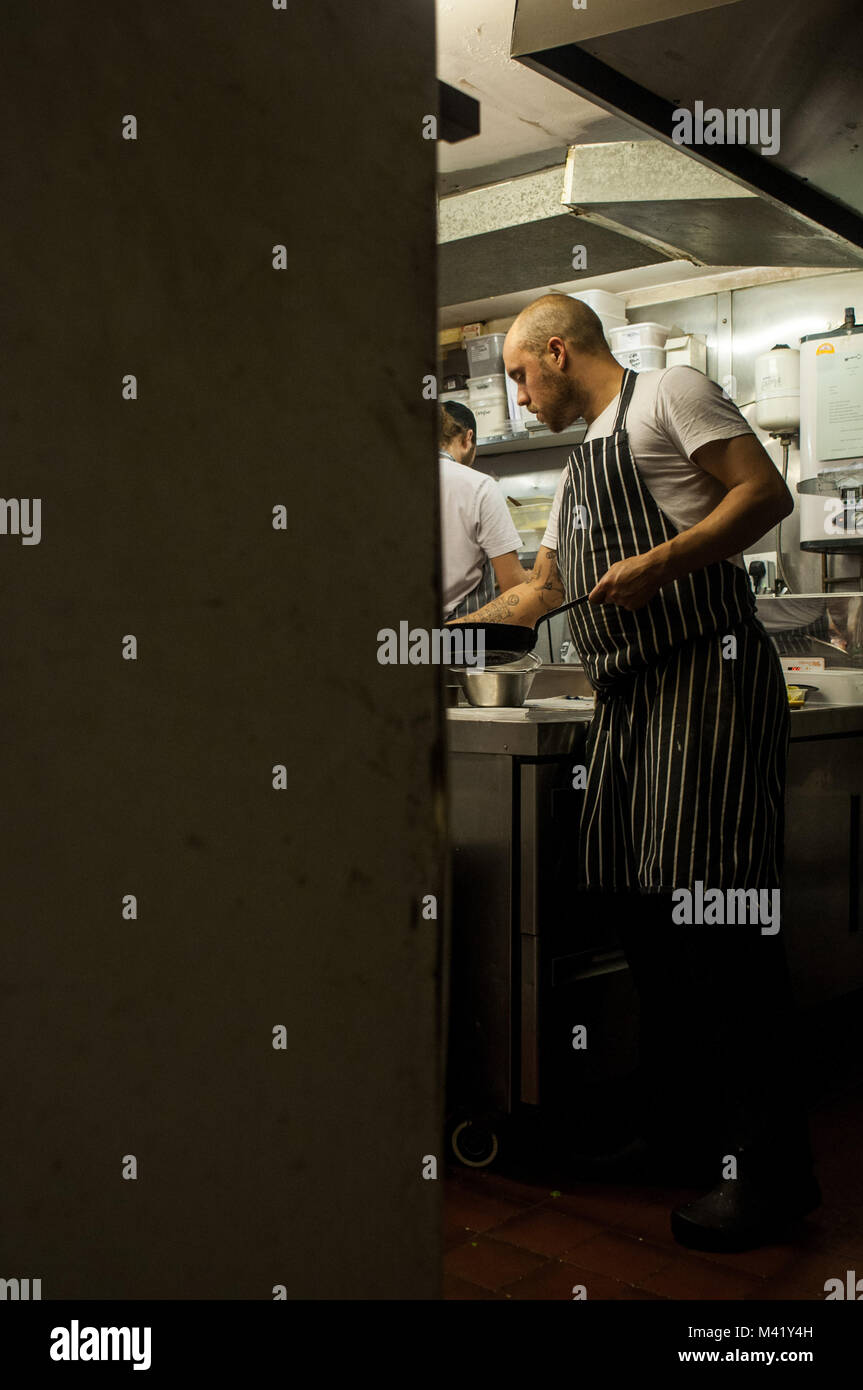 A chef working on his feet in a restaurant kitchen in Bristol, England