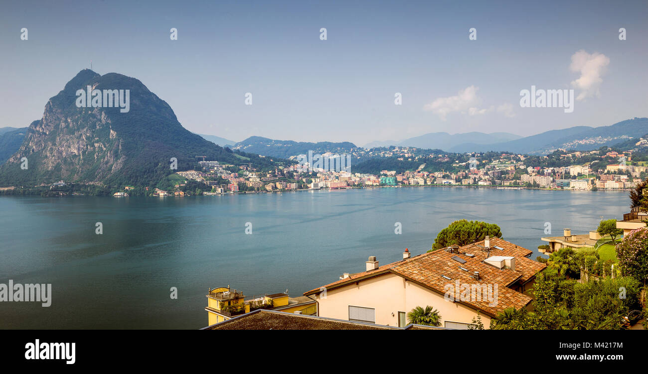 View to Lugano city, Lugano lake and Monte San Salvatore from Monte Bre, Ticino, Switzerland Stock Photo