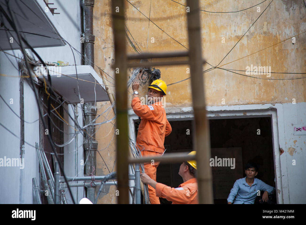 local power line workers working on energy and power lines in Hanoi