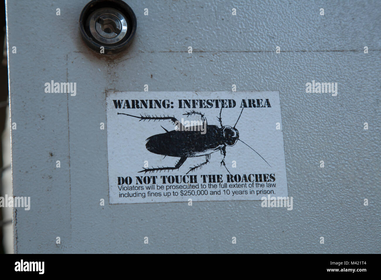 Warning infested area do not touch the roaches sticker sign in Sapa Vietnam Stock Photo
