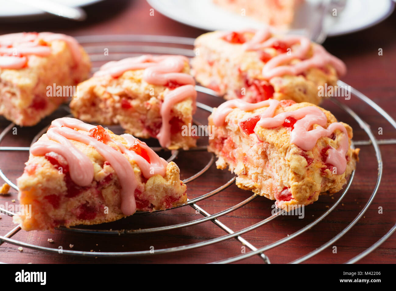 Homemade cherry almond scones on a cooling rack. Stock Photo