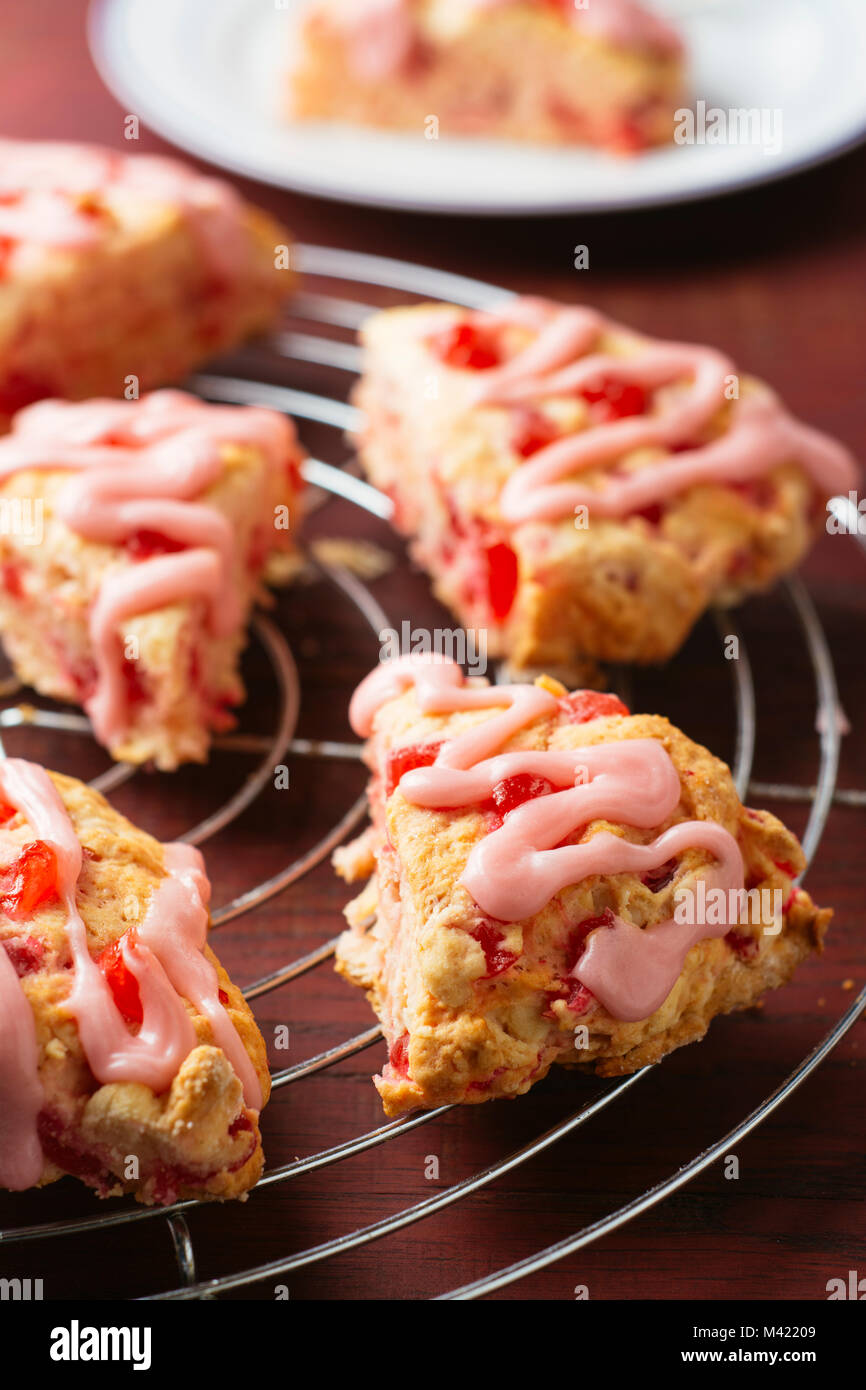 Homemade cherry almond scones on a cooling rack. Stock Photo