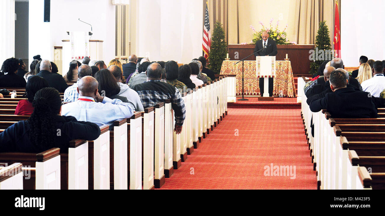 Pastor Derek Grier of Grace Church, Dumfries, Virginia,  stands at the pulpit at the Marine Memorial Chapel aboard Quantico as members of the base community listen attentively about the  legacy of Rev. Martin Luther King Jr. and what they can do to honor his dream. Stock Photo