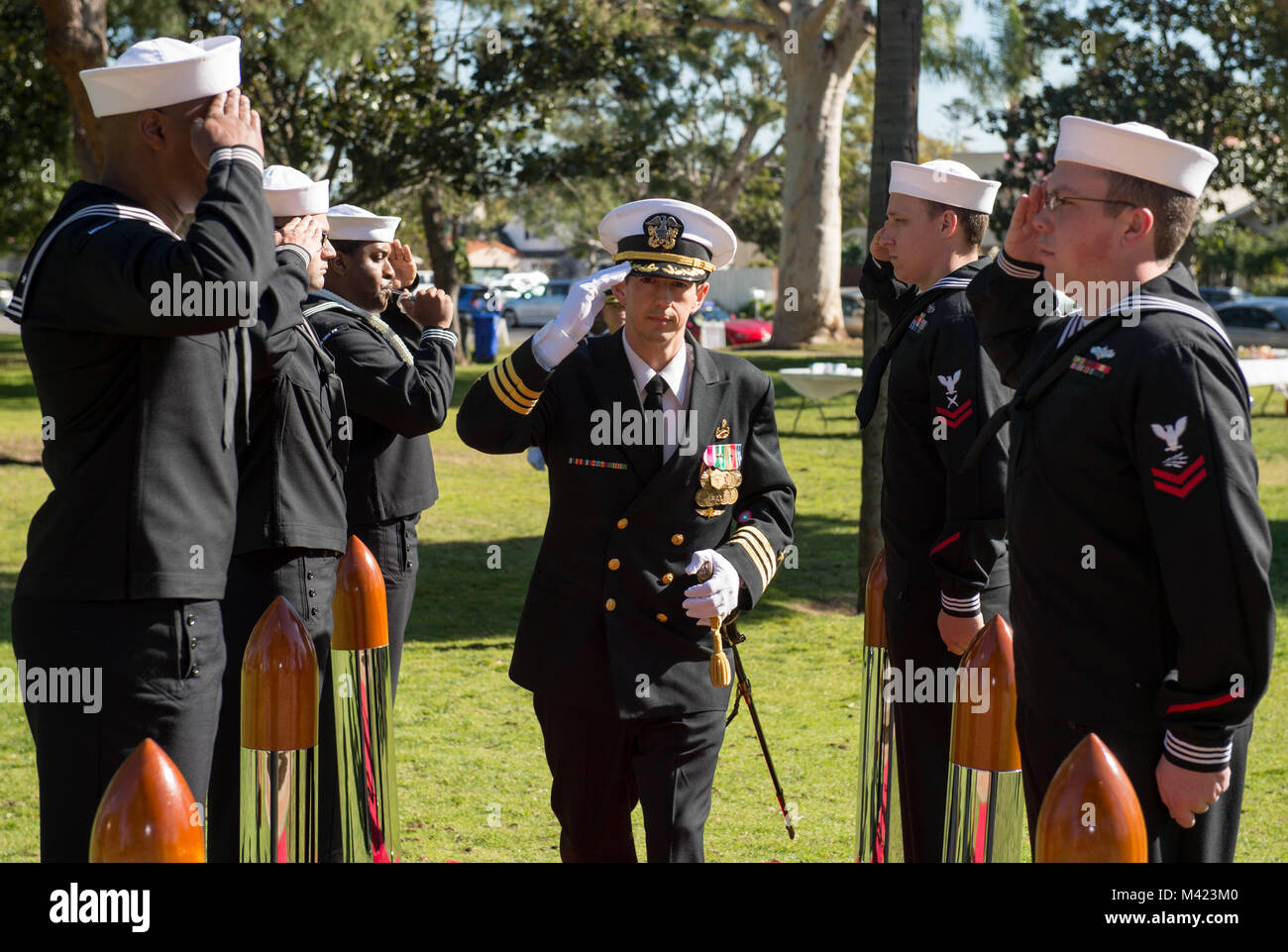 180208-N-HS117-0017  CORONADO, Calif. (Feb. 8, 2018) Cmdr John C. Laney, deputy commander, Mine Countermeasures Division (MCMDIV) 31, salutes sideboys as the official party arrives for the MCMDIV 31 change of command ceremony at Spreckels Park. During the ceremony, Cmdr John C. Laney relieved Cmdr. Don M. McNeil as commander of MCMDIV 31. (U.S. Navy photo by Mass Communication Specialist Seaman Apprentice Jeffery L. Southerland/Released) Stock Photo