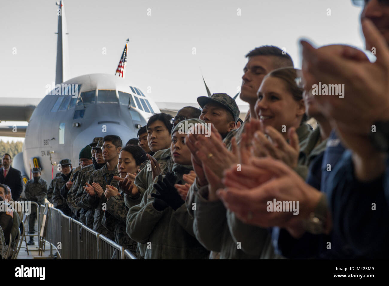 U.S. service members and Japan Air Self-Defense Force members applaud Vice President Michael Pence during his troop talk, Feb. 8, 2018, at Yokota Air Base, Japan. During the speech Pence spoke to the importance of a strong Japanese-U.S. relationship to help ensure stability in the Indo-Asia Pacific region. (U.S. Air Force photo by Senior Airman Donald Hudson) Stock Photo