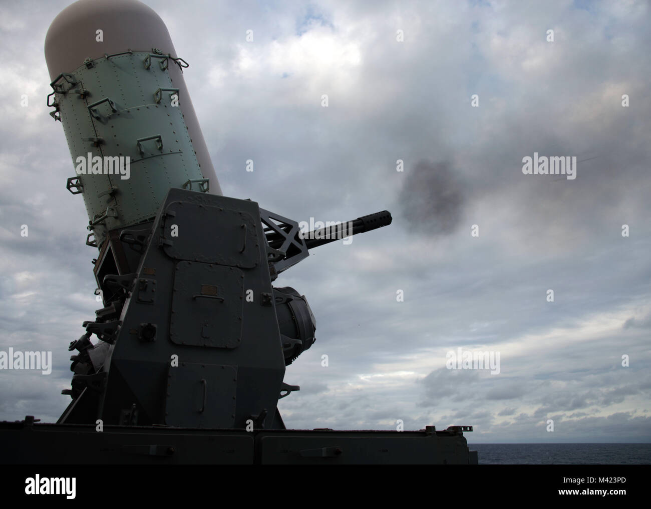 MAYPORT, Fla. (Feb. 8, 2018) The aft close-in weapons system (CIWS) fires from the fantail of the amphibious assault ship USS Iwo Jima (LHD 7).  The Iwo Jima Amphibious Ready Group (ARG) is deployed in support of maritime security operations and theater security cooperation efforts in Europe and the Middle East.  The Iwo Jima ARG embarks the 26th Marine Expeditionary Unit and includes Iwo Jima, the amphibious transport dock ship USS New York (LPD 21), the dock landing ship USS Oak Hill (LSD 51), Fleet Surgical Team 8, Helicopter Sea Combat Squadron 28, Tactical Air Control Squadron 22, compone Stock Photo
