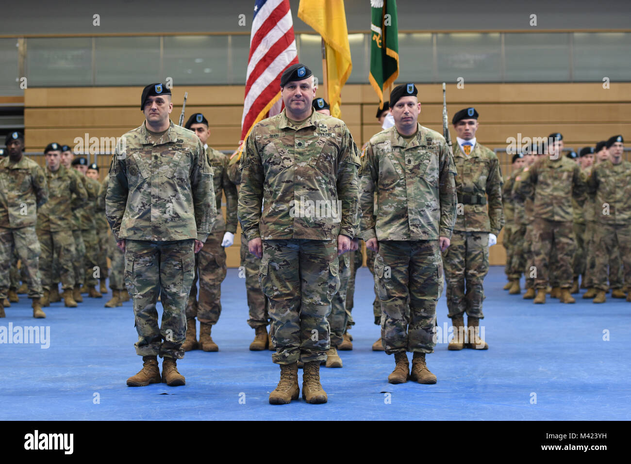 From left to right: U.S. Army Command Sgt. Maj. Joshua Kreitzer, incoming senior enlisted advisor of 709th Military Police (MP) Battalion (BN), 18th MP Brigade, Lt. Col. Jeffrey Searl, commander of 709th MP BN, and Command Sgt. Maj. Ethan Bradley, outgoing senior enlisted advisor of 709th MP BN, stand in formation during a change of responsibility ceremony at Tower Barracks, Grafenwoehr, Germany, Feb. 09, 2018.   (U.S. Army photo by Markus Rauchenberger) Stock Photo