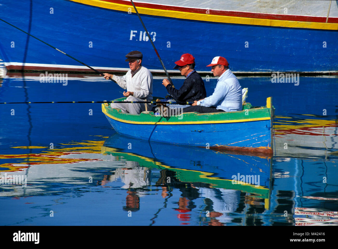 fishing men, Marsaxlokk harbour,  Malta, Europe Stock Photo