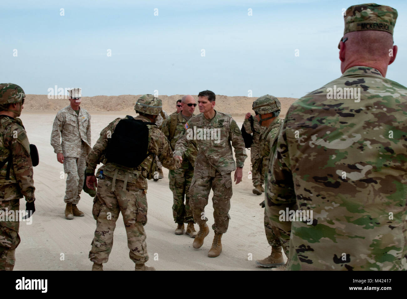 General Joseph Votel, commander, U.S. Central Command, shakes hands