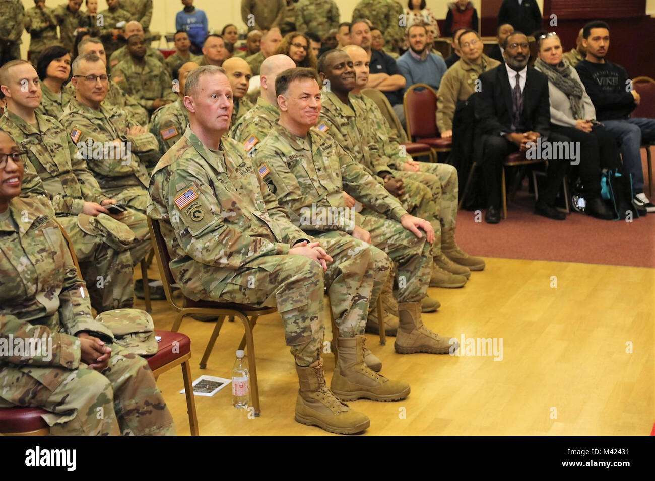 Brig Gen. Fred Maiocco, the 7th MSC commanding general and 21st Theater Sustainment Command deputy commanding general (center, left) and Col William S. Galbraith, 21st TSC deputy commanding officer (center, right) listen during the U.S. Army Garrison Rheinland-Pfalz African-American History Month celebration hosted by the Army Reserve’s 7th Mission Support Command Feb. 9 at the Kaiserslautern Army Community Center on Daenner Kaserne. Stock Photo