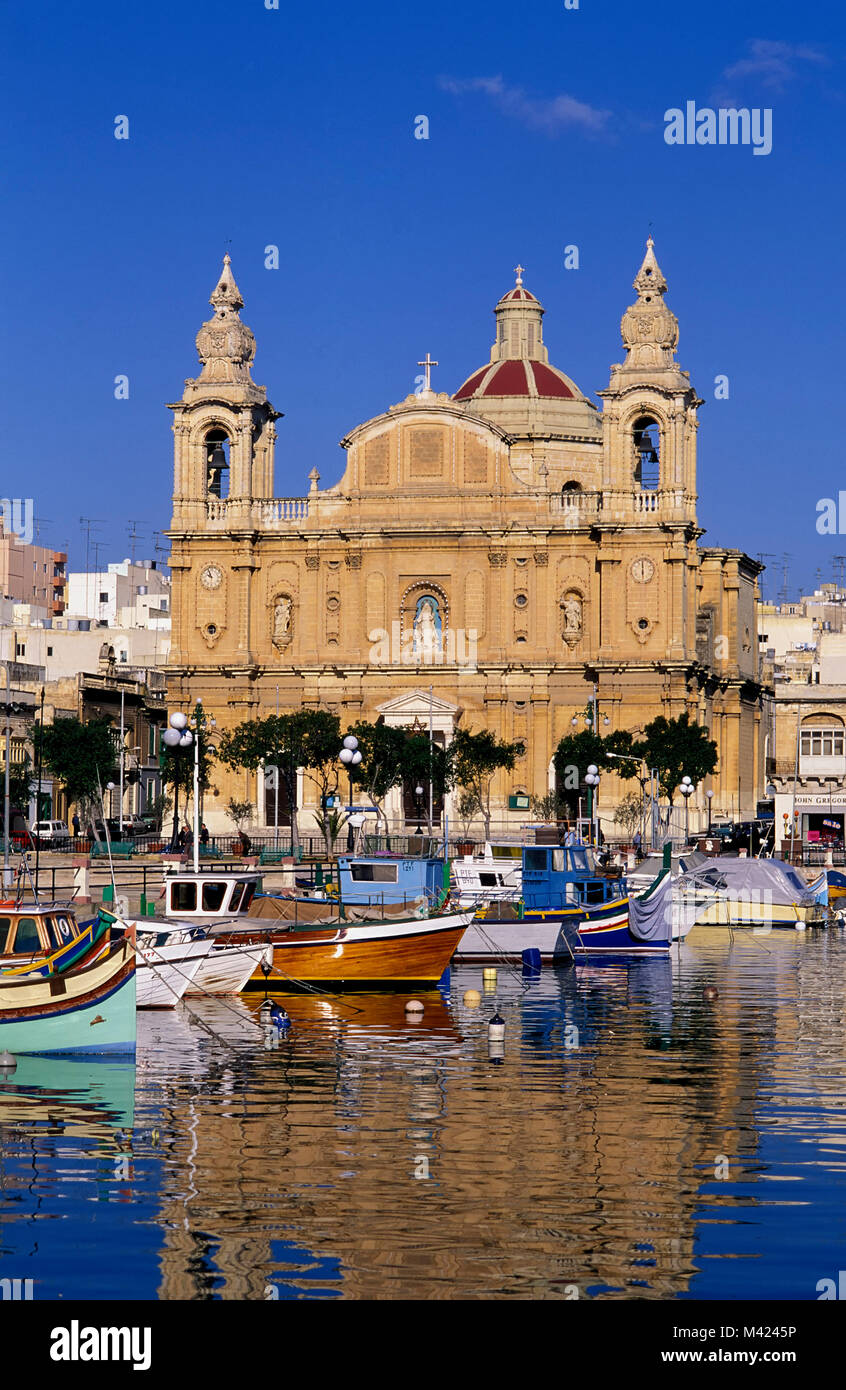 Msida, fishing boats in front of St.Josefs-church, Malta, Europe Stock Photo