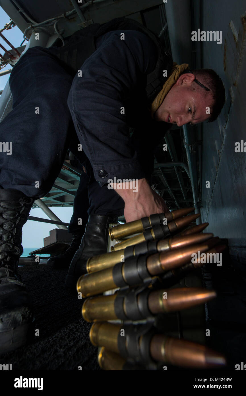 180209-N-NB544-037 GULF OF THAILAND (Feb. 9, 2018) Gunner's Mate Seaman Michael Norris, from Oakdale, Calif., stores rounds of .50-caliber machine gun ammunition during small craft action team (SCAT) training aboard the amphibious assault ship USS Bonhomme Richard (LHD 6). Bonhomme Richard is operating in the Indo-Asia-Pacific region as part of a regularly scheduled patrol and provides a rapid-response capability in the event of a regional contingency or natural disaster. (U.S. Navy photo by Mass Communication Specialist 2nd Class Kyle Carlstrom/Released) Stock Photo