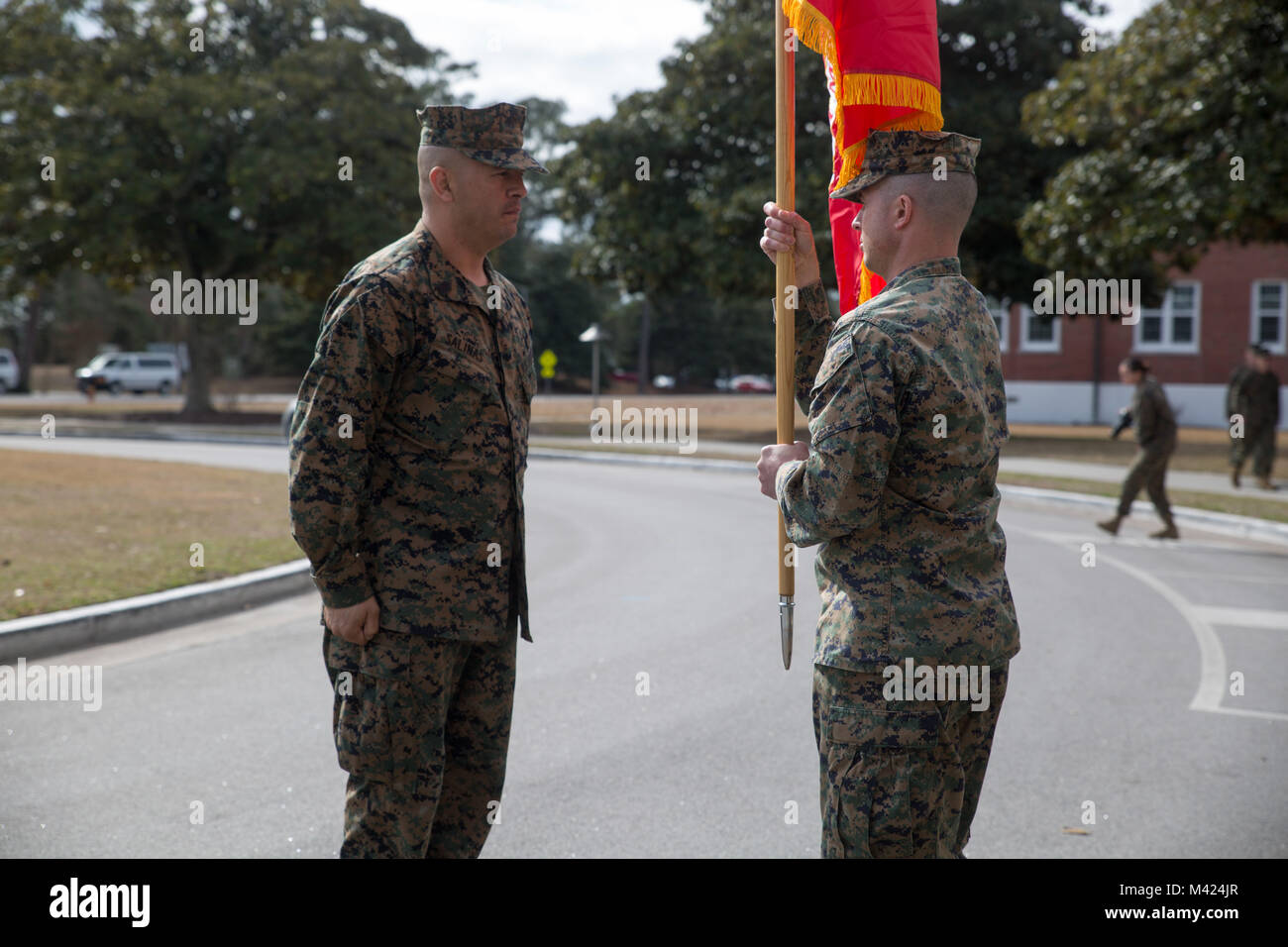 Lt. Col. Joshua Whamond receives the unit colors during an activation ceremony for the first ever II Marine Expeditionary Force Support Battalion at Camp Lejeune, N.C., Feb. 9, 2018. The new battalion, part of the II MEF Information Group, is designed to provide and coordinate combat-service support as well as security and administrative services to the MEF Command Element or Marine Expeditionary Brigade Command Element and MEF Information Group in order to sustain command and control of Marine Air-Ground Task Force operations. The activation of the MSB is in line with the Commandant's priorit Stock Photo
