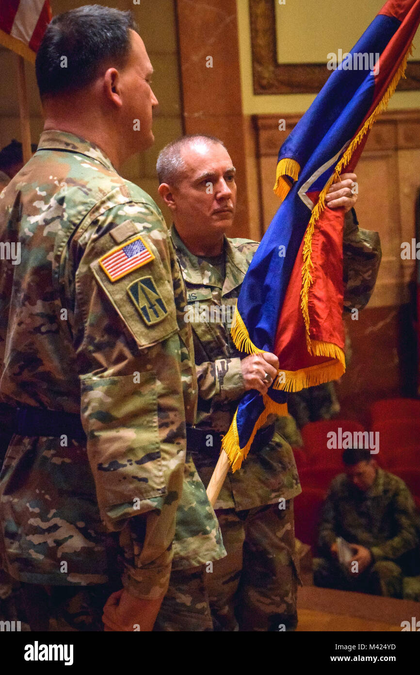Brig. Gen. Gordon L. Ellis receives the 38th Infantry Division flag during the unit’s change of command ceremony in Indianapolis, Sunday, Feb. 11, 2018. “As I assume command, I am cognizant of the need to continue to build sustained readiness across the formation of this division,” said Ellis during his speech. Photo by Sgt. Diana Richardson, 38th Infantry Division Unit Public Affairs Representative Stock Photo