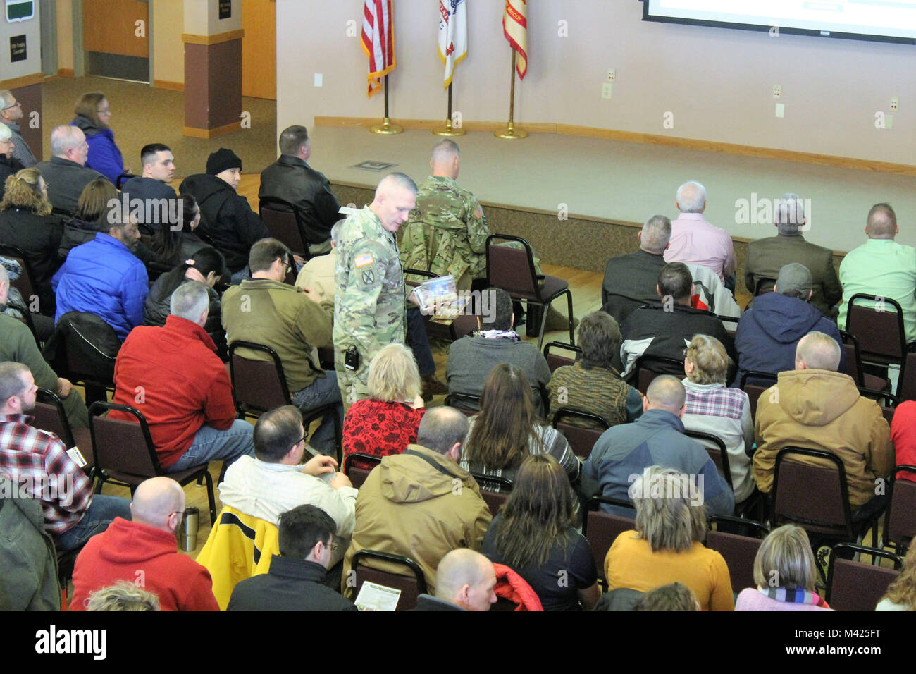 Garrison Commander Col. David J. Pinter Sr. provides his annual briefing to the Fort McCoy workforce Jan. 24, 2018, in building 905 at Fort McCoy, Wis. Pinter held two workforce briefings to hundreds of Fort McCoy employees where he discussed many plans, programs, and future efforts at the installation. (U.S. Army Photo by Scott T. Sturkol, Public Affairs Office, Fort McCoy, Wis.) Stock Photo