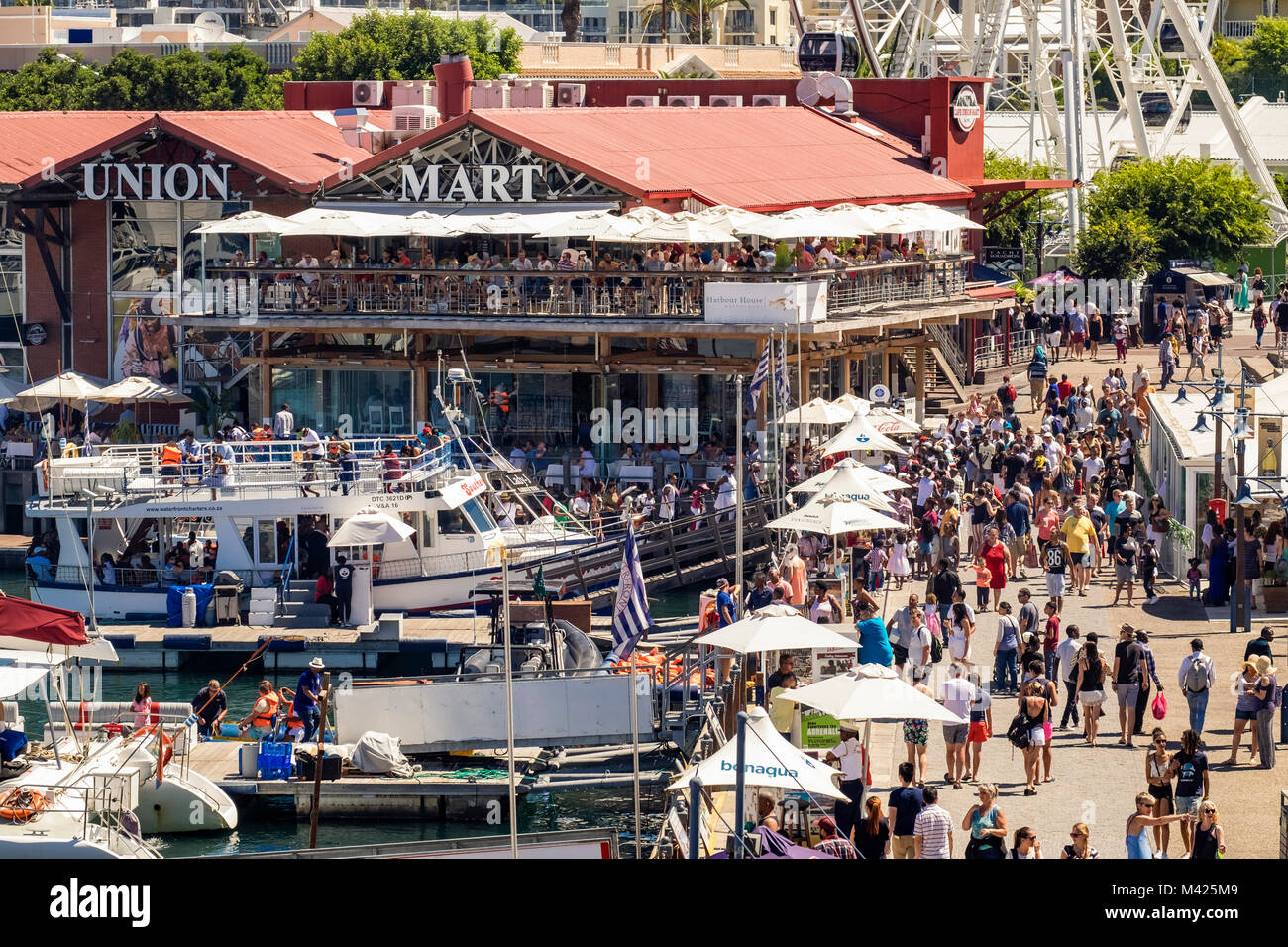 V&A Waterfront, and Cape Union Mart in Cape Town city, South Africa busy with people shopping in summer Stock Photo