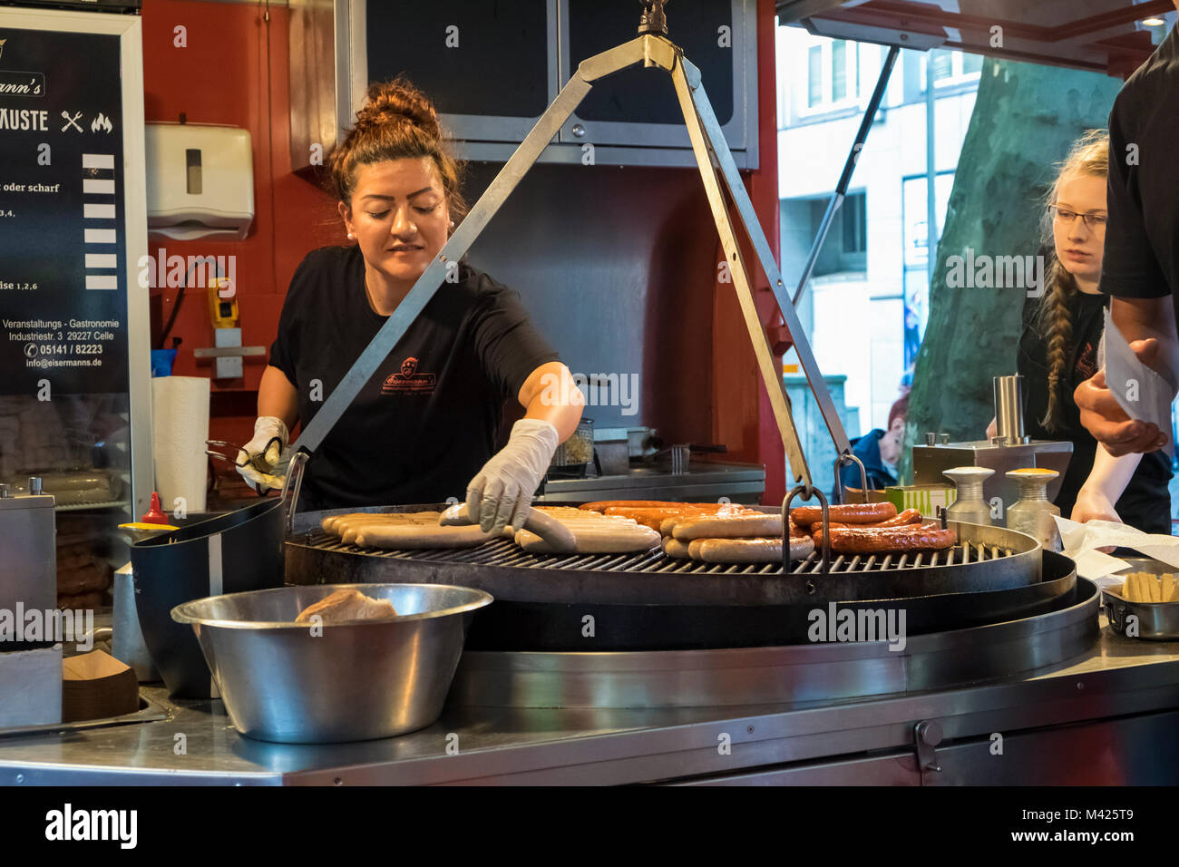 Making Currywurst, German sausage hot dogs, in Hamburg, Germany Stock Photo
