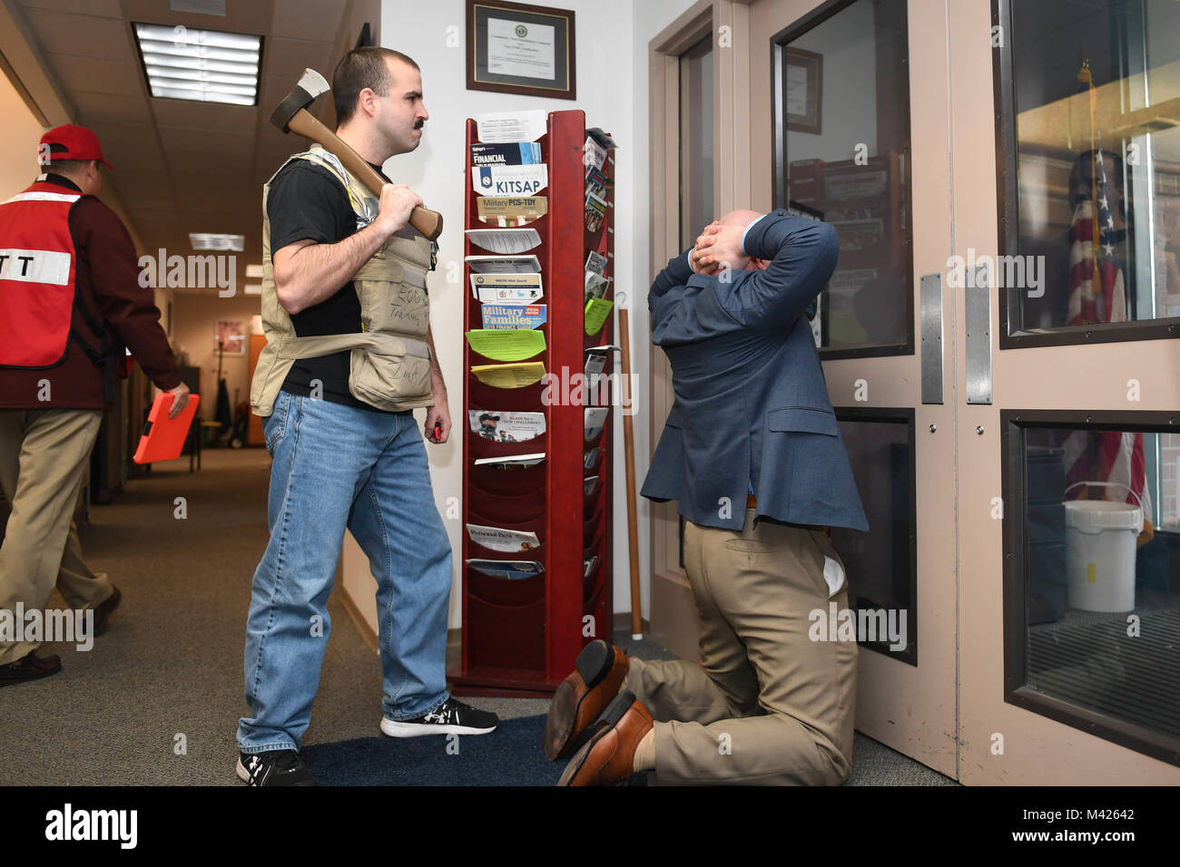 180131-N-NP779-0036 SILVERDALE, Wash. (Jan. 31, 2018) Master-at-Arms 1st Class Jordan Jones plays the role of a terrorist, holding hostage Paul Rosarius, NBK Fleet and Family Readiness Director, during a Naval Base Kitsap active shooter drill as part of Exercise Citadel Shield-Solid Curtain 2018 (CS/SC 18). CS/SC 18 is an anti-terrorism and force protection exercise conducted by Navy installations within the continental United States to ensure that the Navy is ready to respond to changing and dynamic threats at all times.   (U.S. Navy photo by Mass Communication Specialist 1st Class Ty Connors Stock Photo