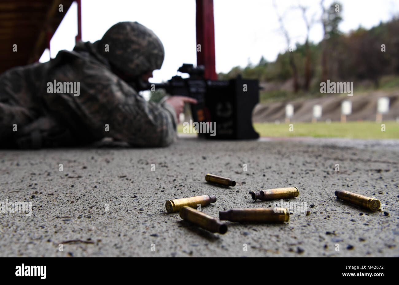 Shell casings from an M-4 carbine lay on the ground during the 627th Security Forces Squadron’s Combat Arms Training and Maintenance (CATM) class at Joint Base Lewis-McChord, Wash., Jan. 31, 2018. Team McChord Airmen undergoing CATM fired practice rounds where they could receive coaching from instructors before firing for their qualification. (U.S. Air Force photo by Senior Airman Tryphena Mayhugh) Stock Photo
