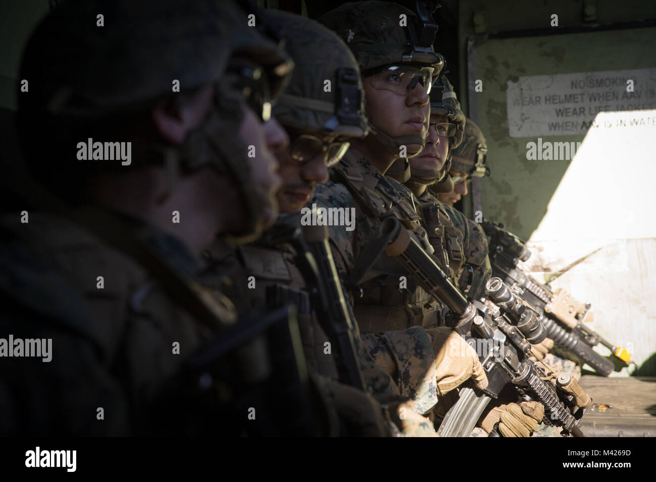 U.S. Marines with Kilo Company, Battalion Landing Team (BLT), 3rd Battalion, 1st Marine Regiment prepare for an assault exercise on Camp Pendleton, California, Jan. 31, 2018. BLT 3/1 is refining tactics, techniques, and procedures applicable to raid operations in order to enhance their ability to conduct expeditionary operations while deployed. (U.S. Marine Corps photo by Cpl. Danny Gonzalez) Stock Photo