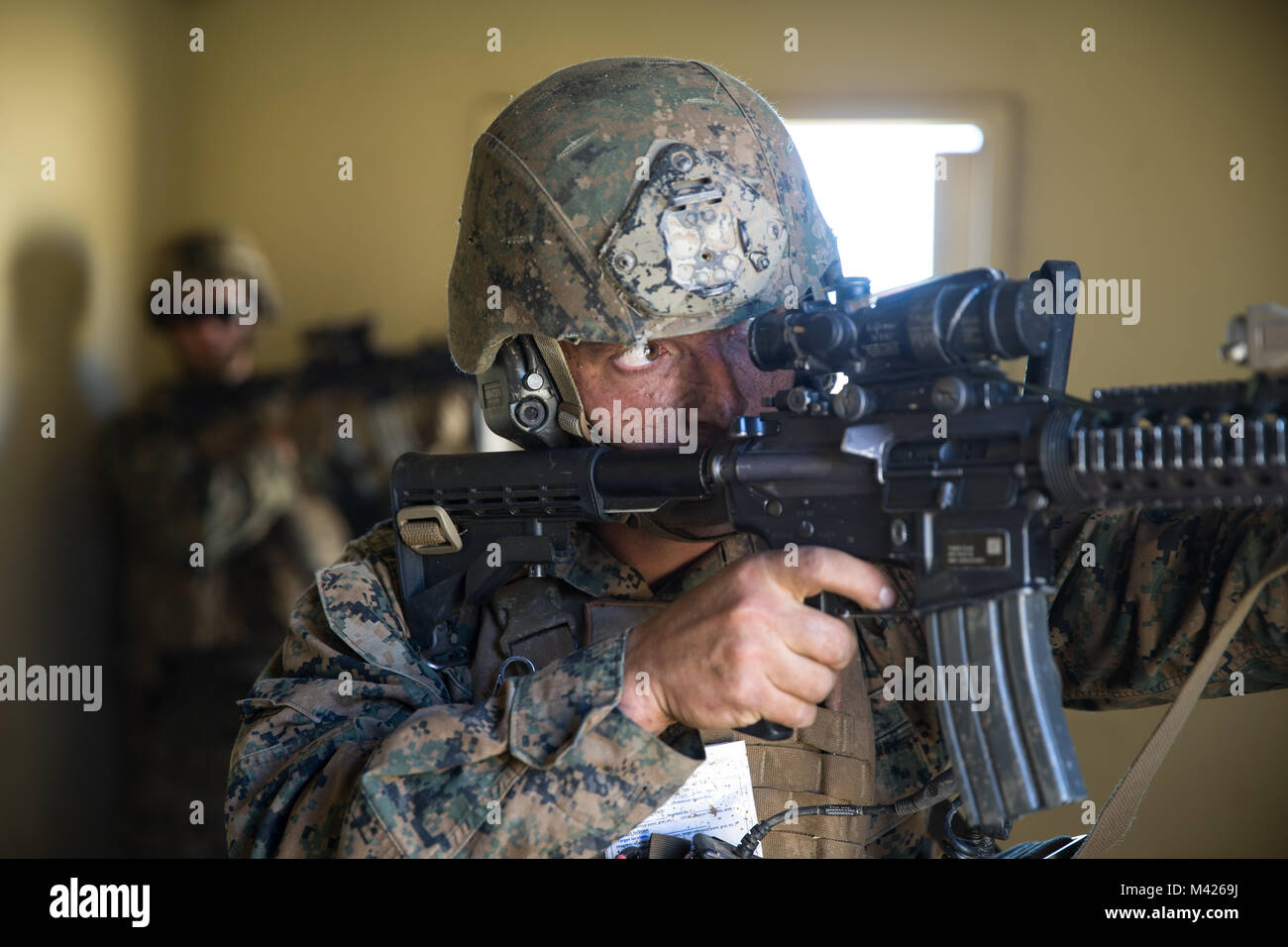 A U.S. Marine with Kilo Company, Battalion Landing Team (BLT), 3rd Battalion, 1st Marine Regiment sights in during an assault exercise on Camp Pendleton, California, Jan. 31, 2018. BLT 3/1 is refining tactics, techniques, and procedures applicable to raid operations in order to enhance their ability to conduct expeditionary operations while deployed. (U.S. Marine Corps photo by Cpl. Danny Gonzalez) Stock Photo