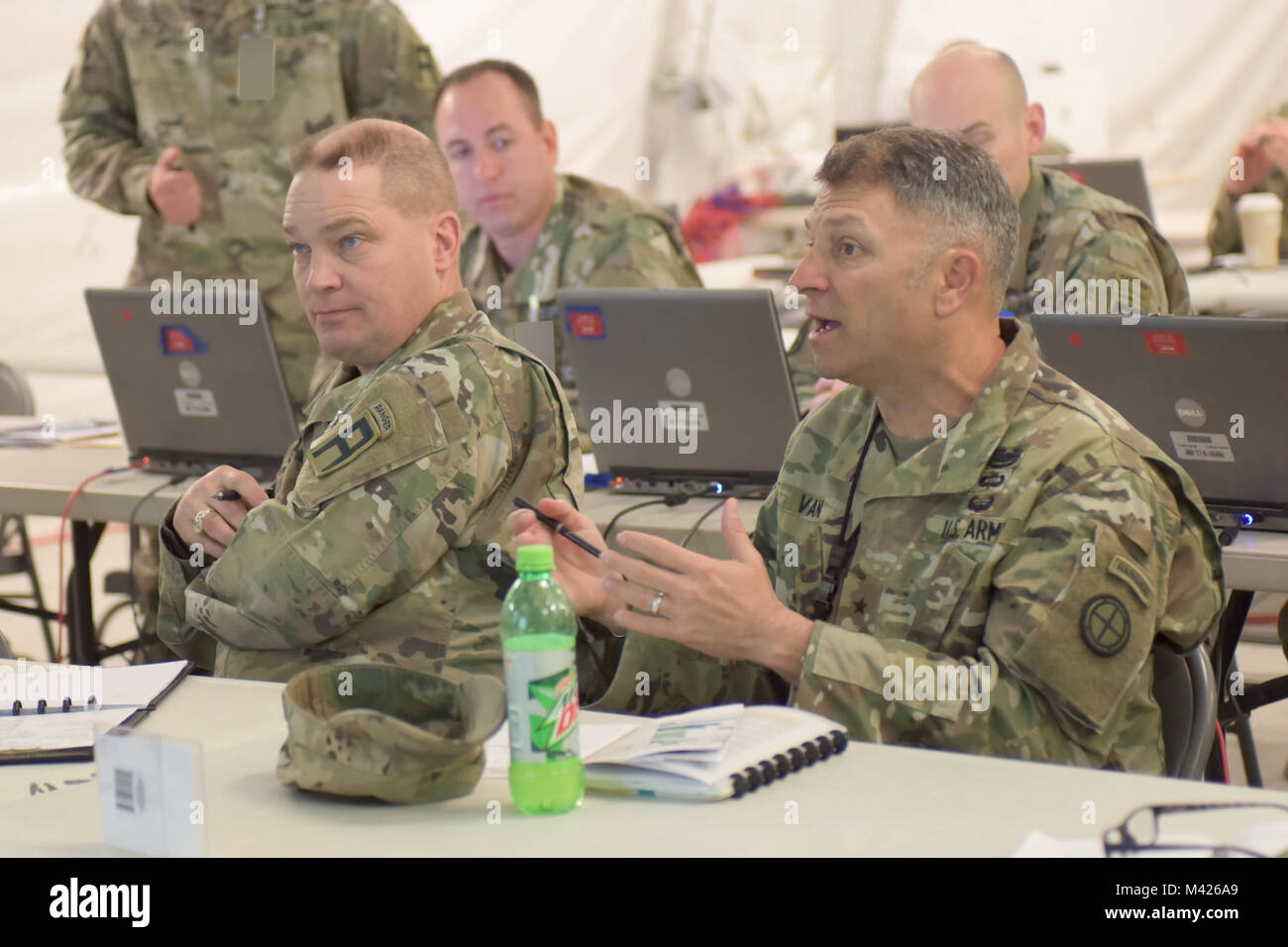 Brig. Gen. Jeffrey Van, deputy commanding general of the Kansas Army National Guard's 35th Infantry Division and senior mentor of the culminating training exercise for the Pennsylvania Army National Guard's 28th Infantry Division, leads a discussion during a briefing at Fort Hood, Texas, Jan. 31, 2018. The 28th ID is preparing to deploy to the Middle East, where they will take over the 35th ID's current mission of supporting combat operations and theater security cooperation with the United States' 17 partner nations in the region. (Photo altered for security purposes.) Stock Photo