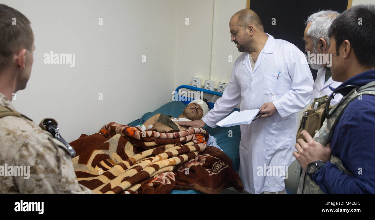 An Afghan solider recovering from injuries in Marjah is visited by ...