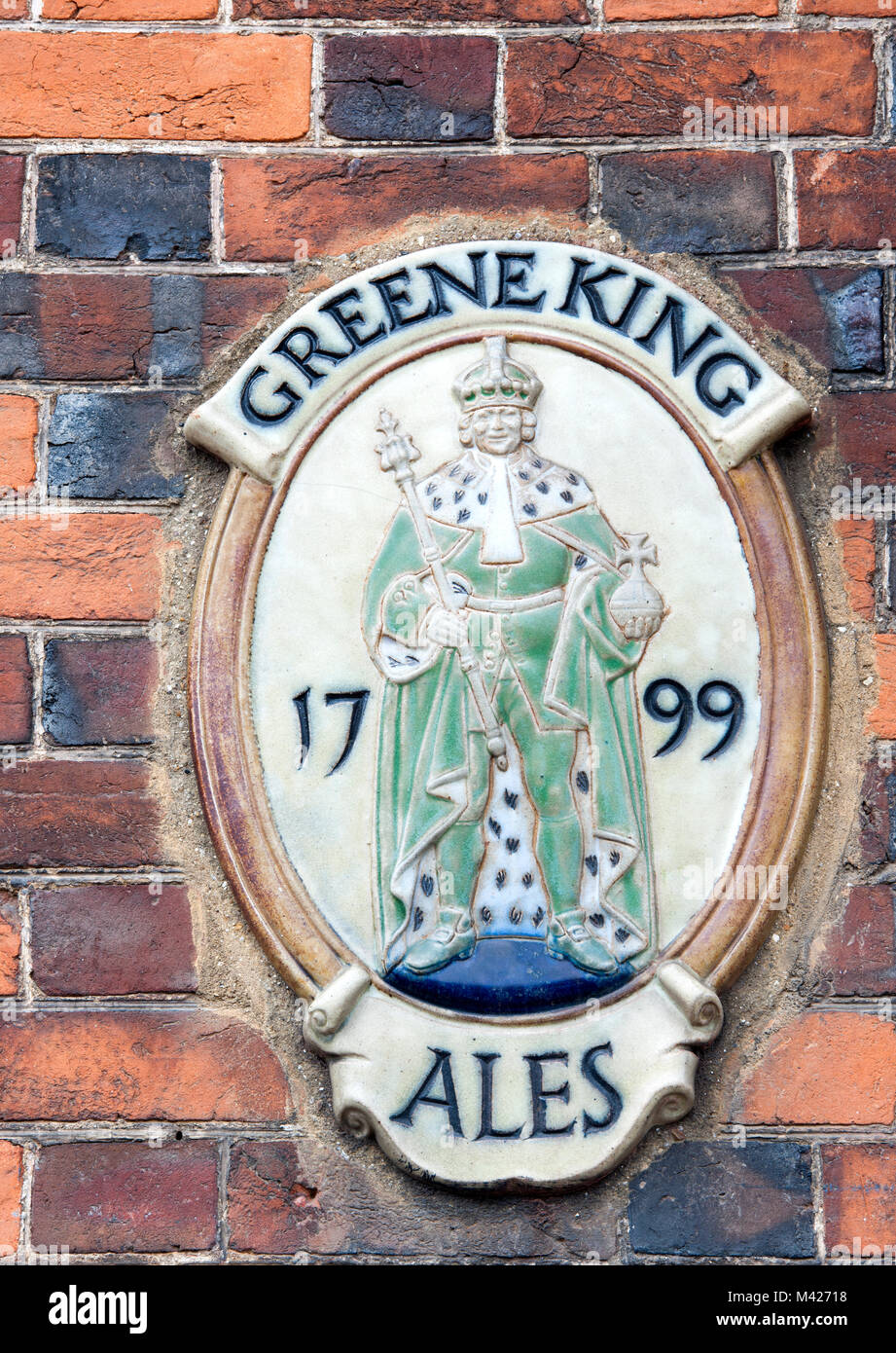 Ceramic plaque placed outside Greene King public houses, England, UK. Stock Photo
