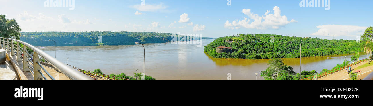 Puerto Iguazu, Argentina - January 07, 2018: Panoramic view from the place where Iguacu river and Parana river meet. Border of three countries: Brazil Stock Photo