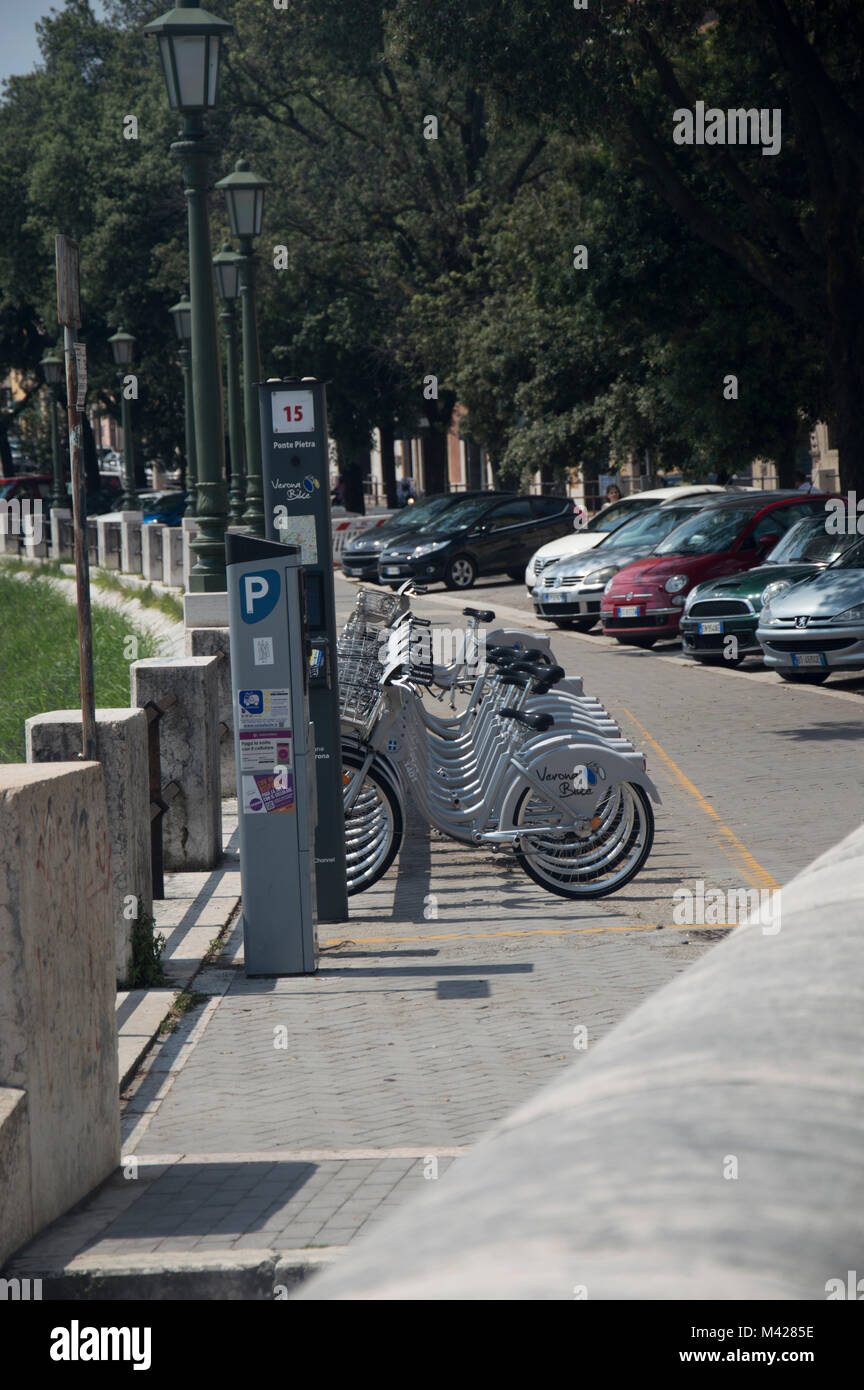 A row of cycles at a Verona Bike station, Verona Italy. Stock Photo