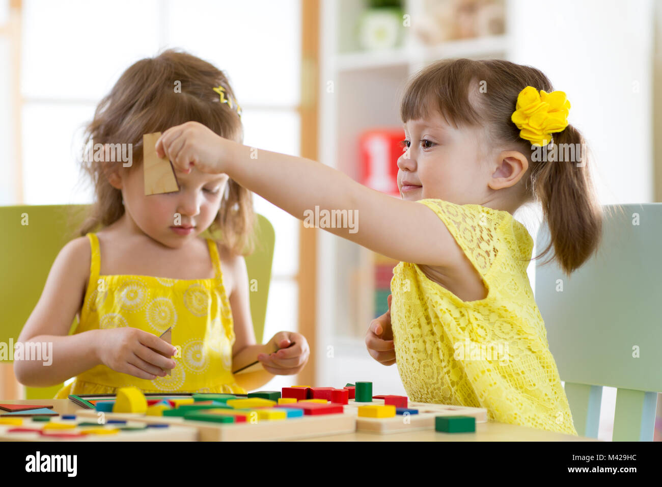  Foto zu Children play educational toys in kindergarten Stock Photo - Alamy 