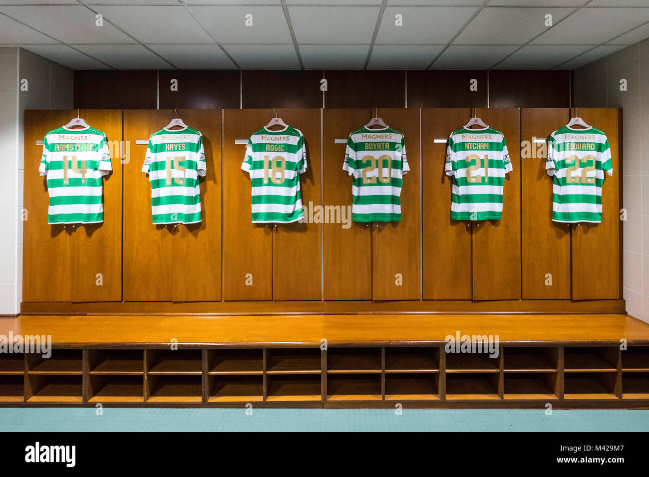 Football strips hanging inside home dressing room at Celtic Park home