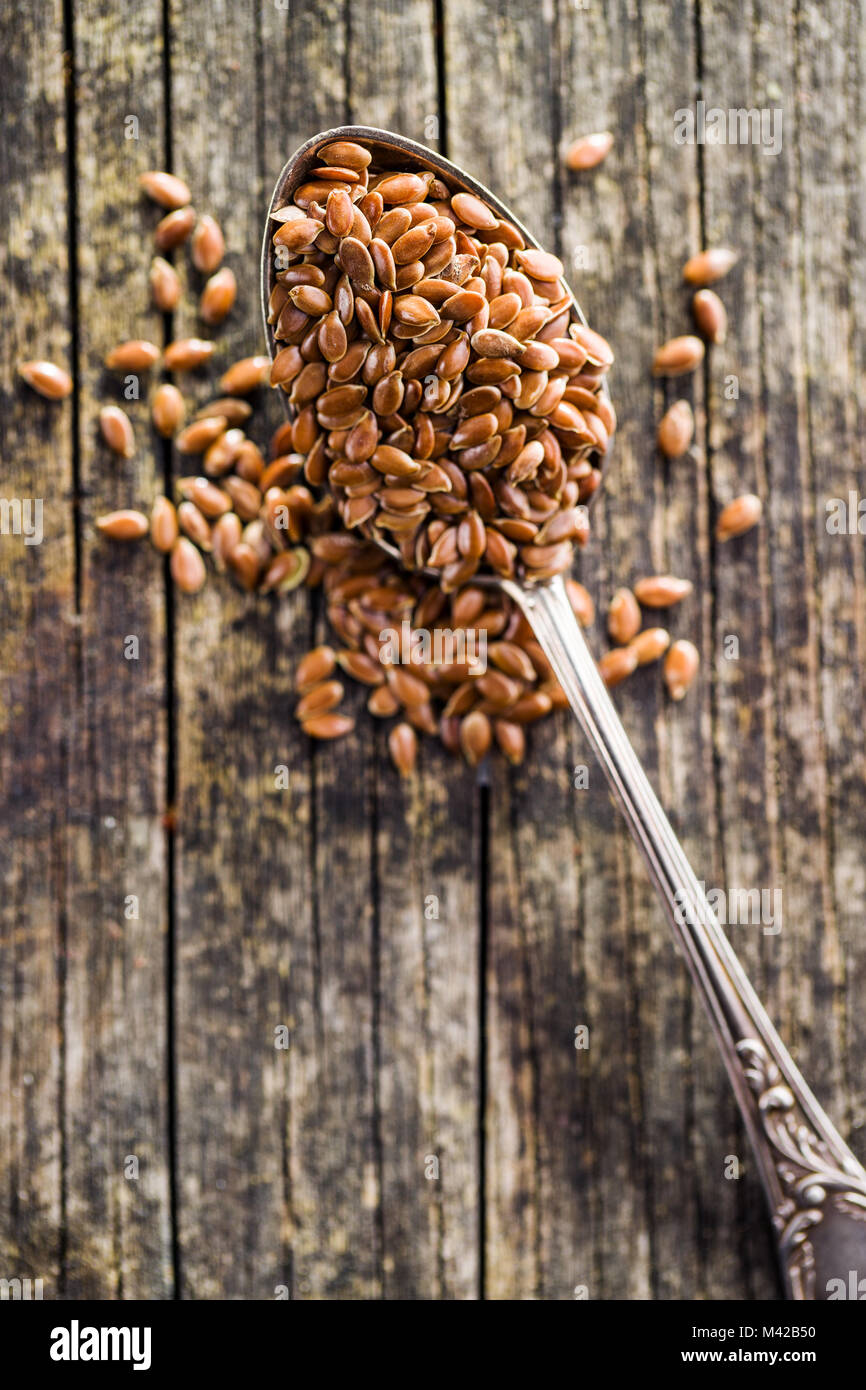 Healthy brown linseed in spoon. Stock Photo