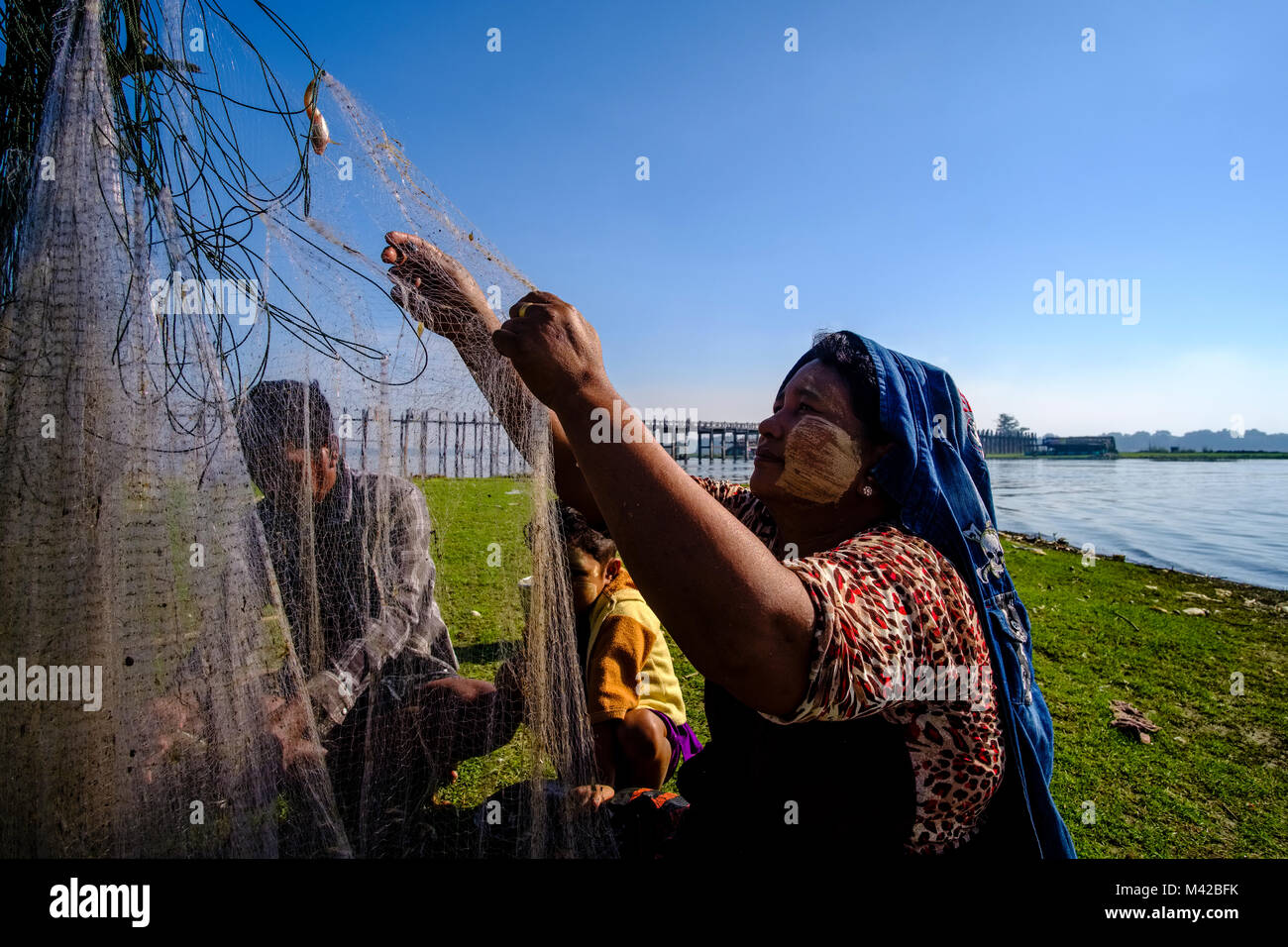 Fishing net woman hi-res stock photography and images - Alamy