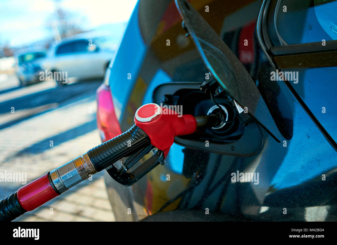 man fills the car at a gas station Stock Photo - Alamy