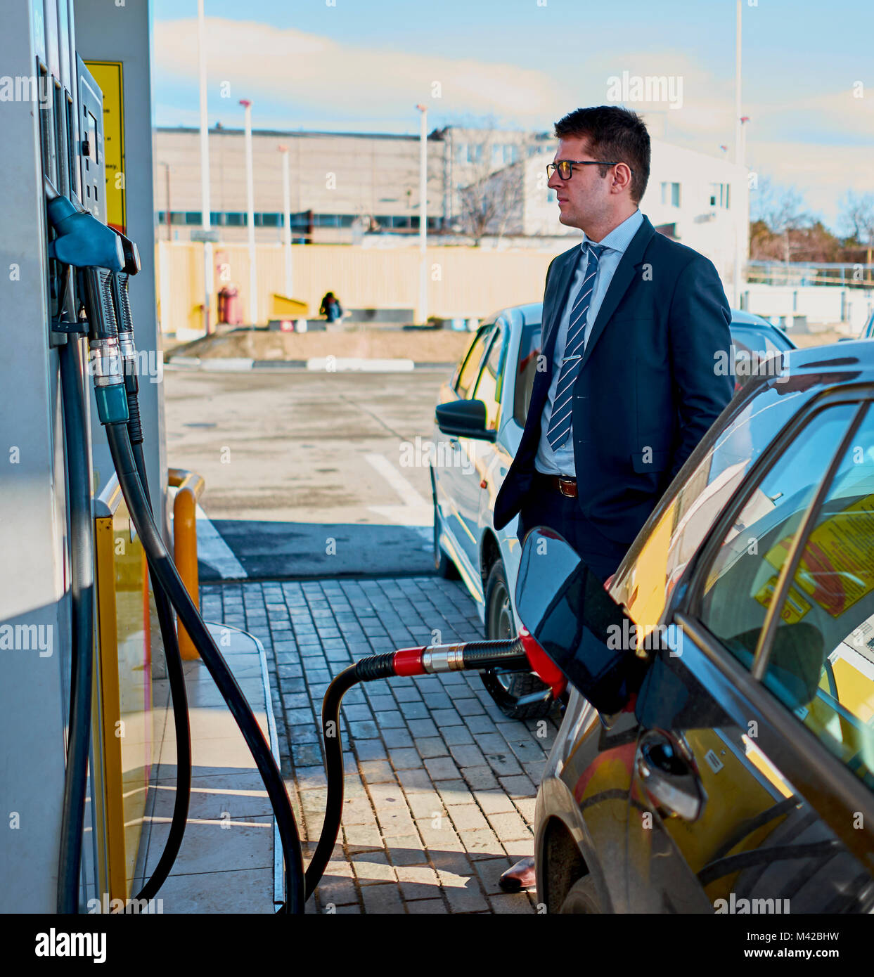 man fills the car at a gas station Stock Photo - Alamy