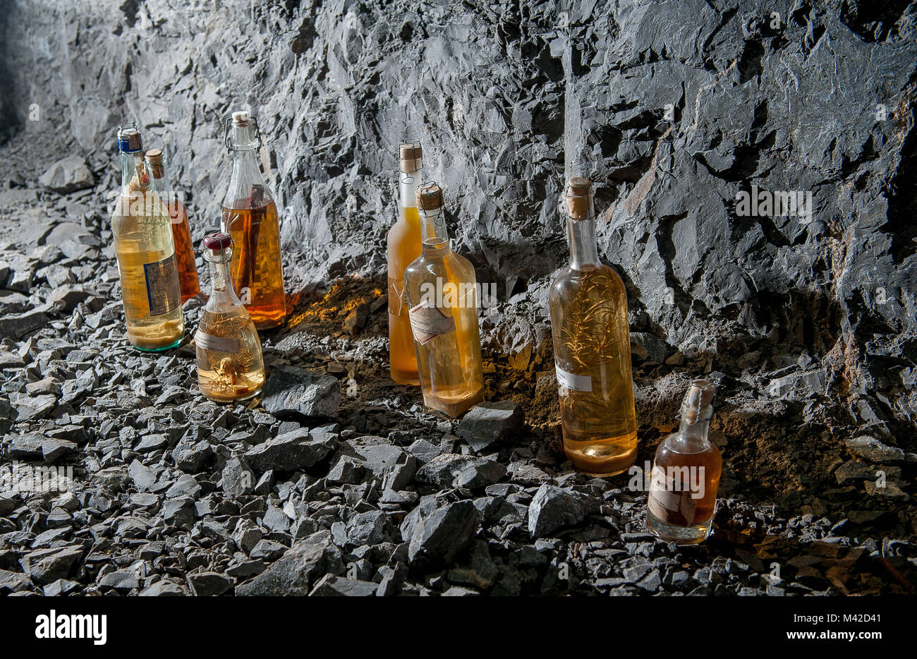 liquor bottles in mining tunnel Stock Photo