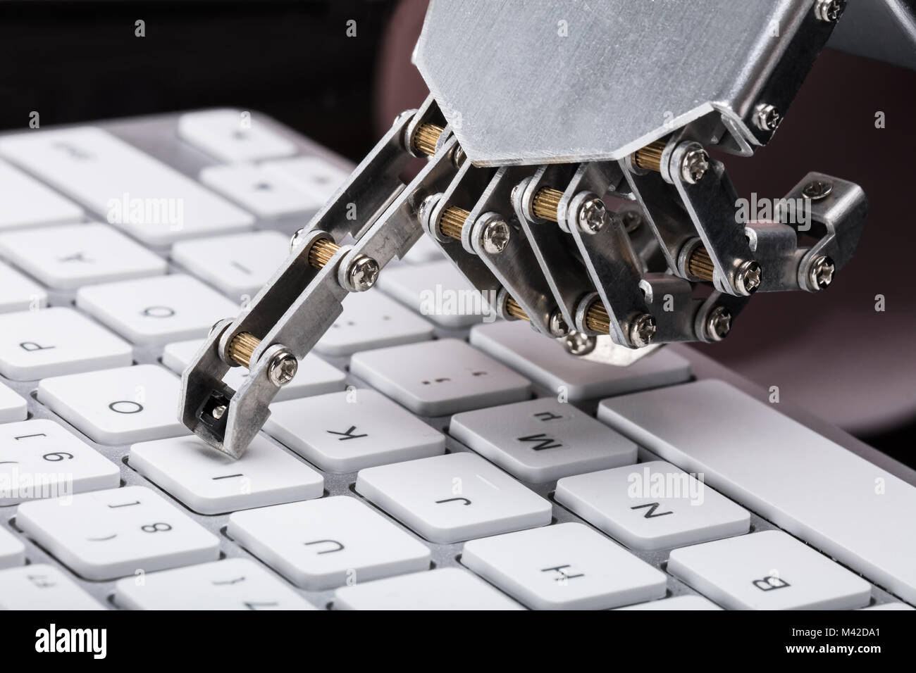 Robot typing on computer keyboard hi-res stock photography and images ...
