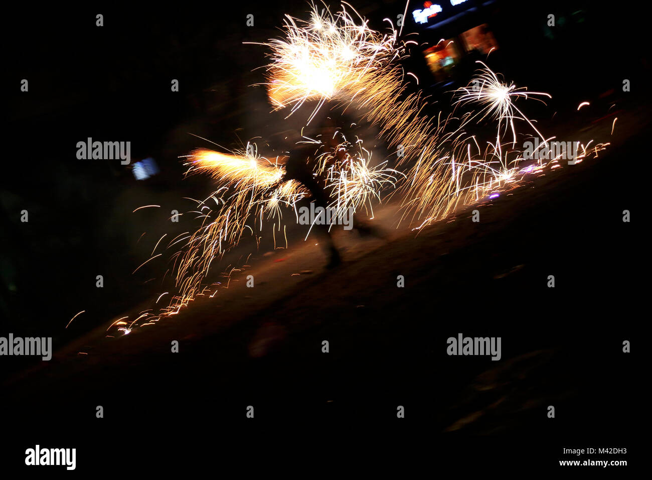 people are playing with fireworks in beijing for the chinese new playing with fire works