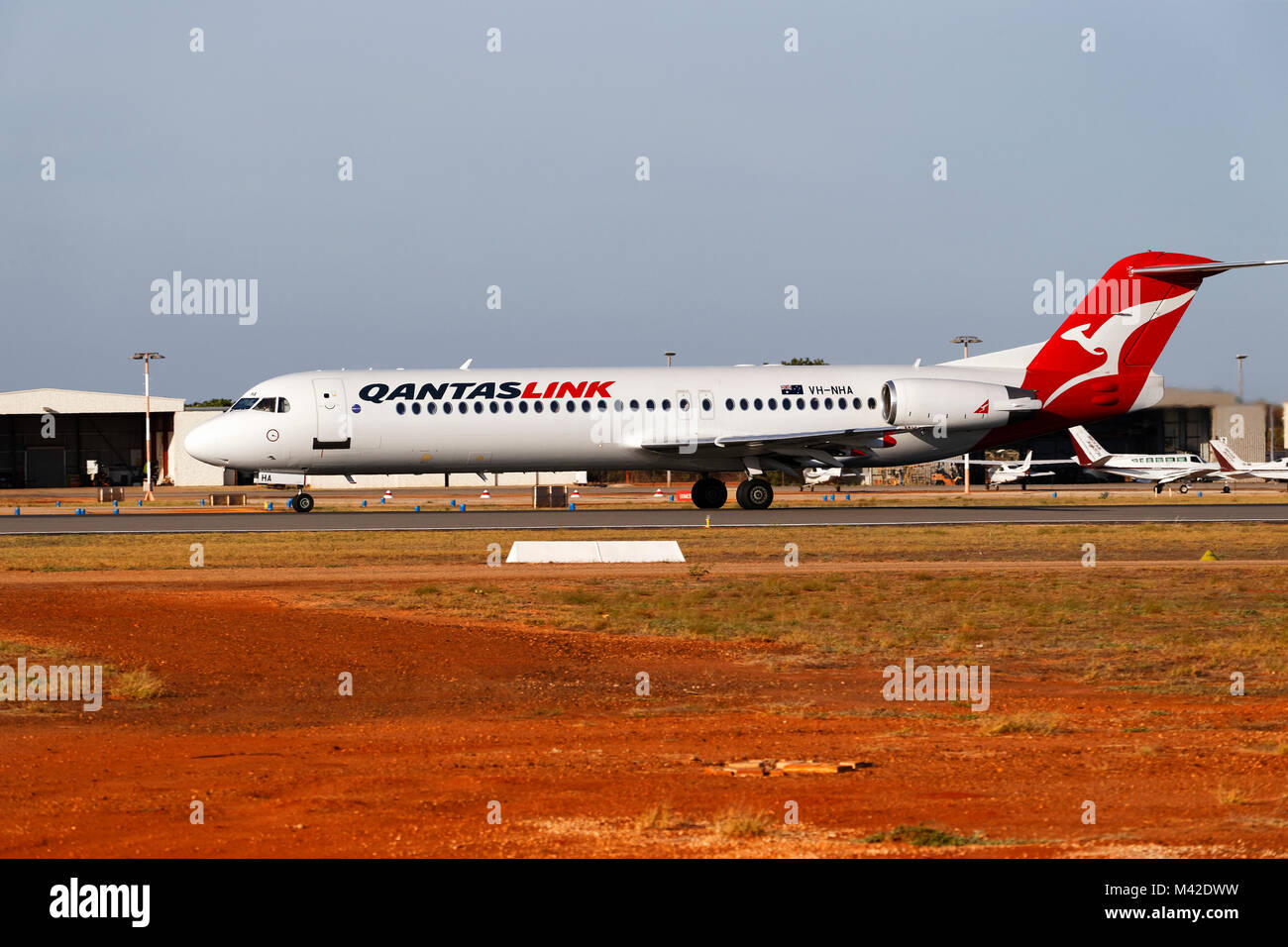 Qantas link passenger aircraft on runway at Broome airport ( Focker 100 ),  Broome, West Kimberley, Western Australia Stock Photo