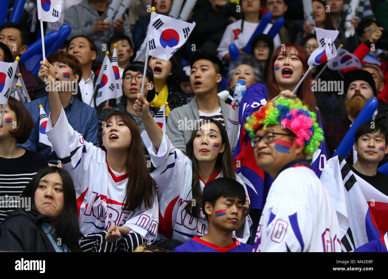 KYIV, UKRAINE - APRIL 28, 2017: South Korean fans show their support during IIHF 2017 Ice Hockey World Championship Div 1 Group A game against Ukraine Stock Photo