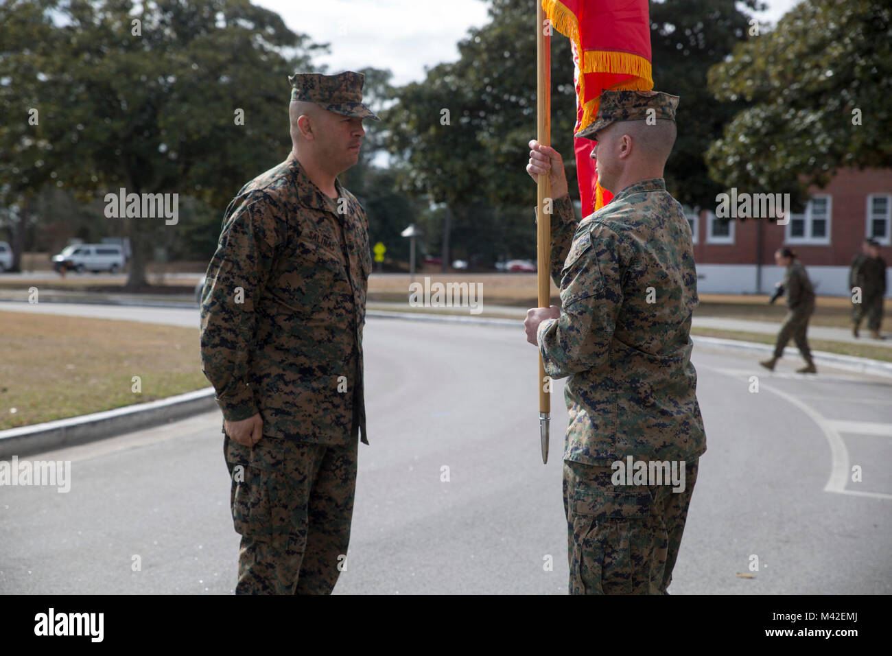 Lt. Col. Joshua Whamond receives the unit colors during an activation ceremony for the first ever II Marine Expeditionary Force Support Battalion at Camp Lejeune, N.C., Feb. 9, 2018. The new battalion, part of the II MEF Information Group, is designed to provide and coordinate combat-service support as well as security and administrative services to the MEF Command Element or Marine Expeditionary Brigade Command Element and MEF Information Group in order to sustain command and control of Marine Air-Ground Task Force operations. The activation of the MSB is in line with the Commandant's priorit Stock Photo