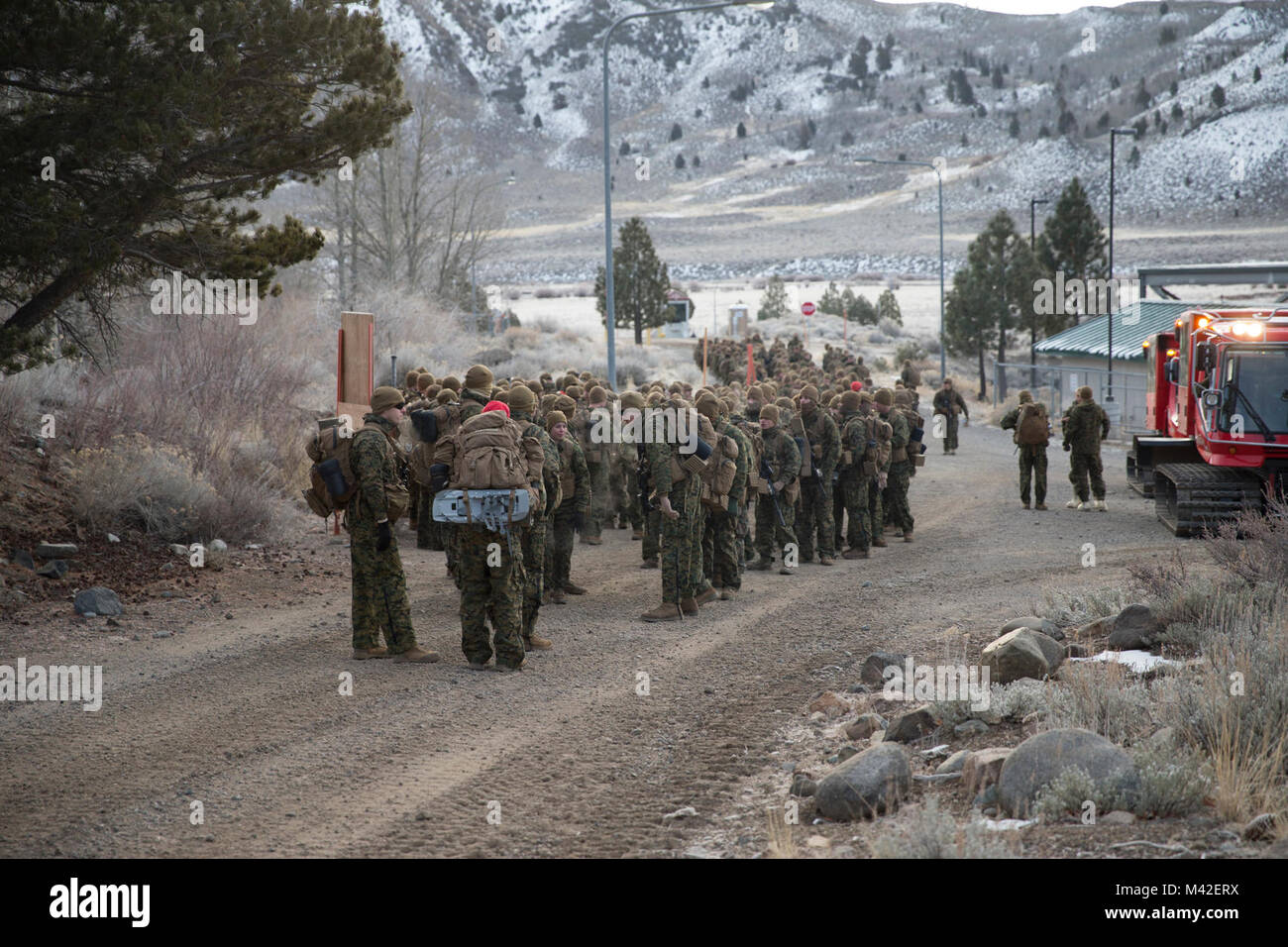 U.S. Marines with  Kilo Company, 3rd Battalion, 8th Marine Regiment, 2nd Marine Division prepare to step off for a 3 mile conditioning hike during Marine Corps Mountain Warfare Training, Bridgeport, Ca., Jan. 23, 2018. The Marines with Kilo Company participate in MTX to increase the units readiness to rapidly respond and accomplish missions involved in cold weather, and mountainous terrain. (U.S. Marine Corps Stock Photo