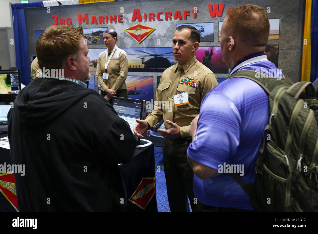 Maj. Salvador Jauregui, the Marine Operational Test Squadron One science and technology officer, answers aviation-related questions at the WEST 2018 in San Diego, Feb. 8. WEST 2018 allows innovators, industry leaders and the military the opportunity to network, learn and work together with the goal of meeting and overcoming challenges facing today's Sea Services. (U.S. Marine Corps Stock Photo