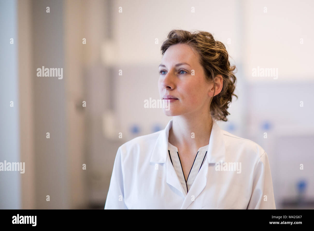 Female medical professional looking thoughtful Stock Photo