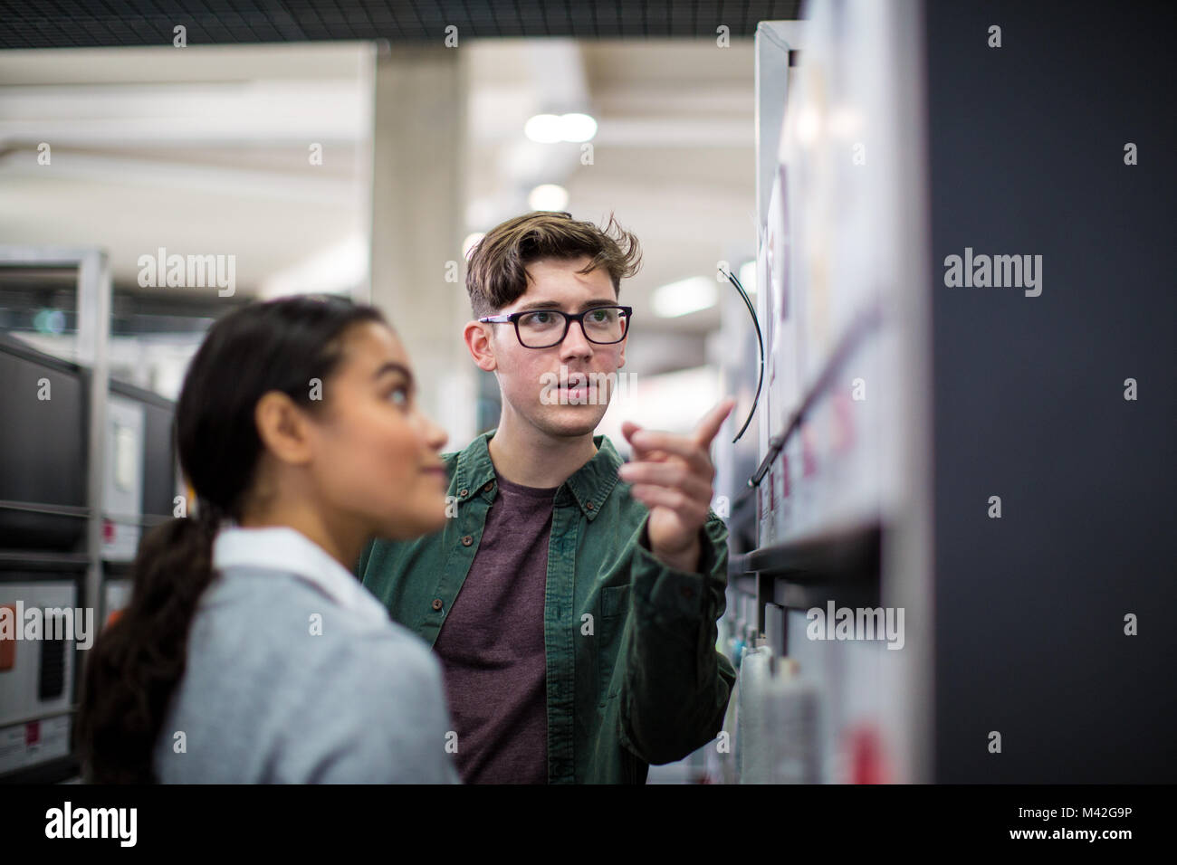 Students looking at an exhibition Stock Photo