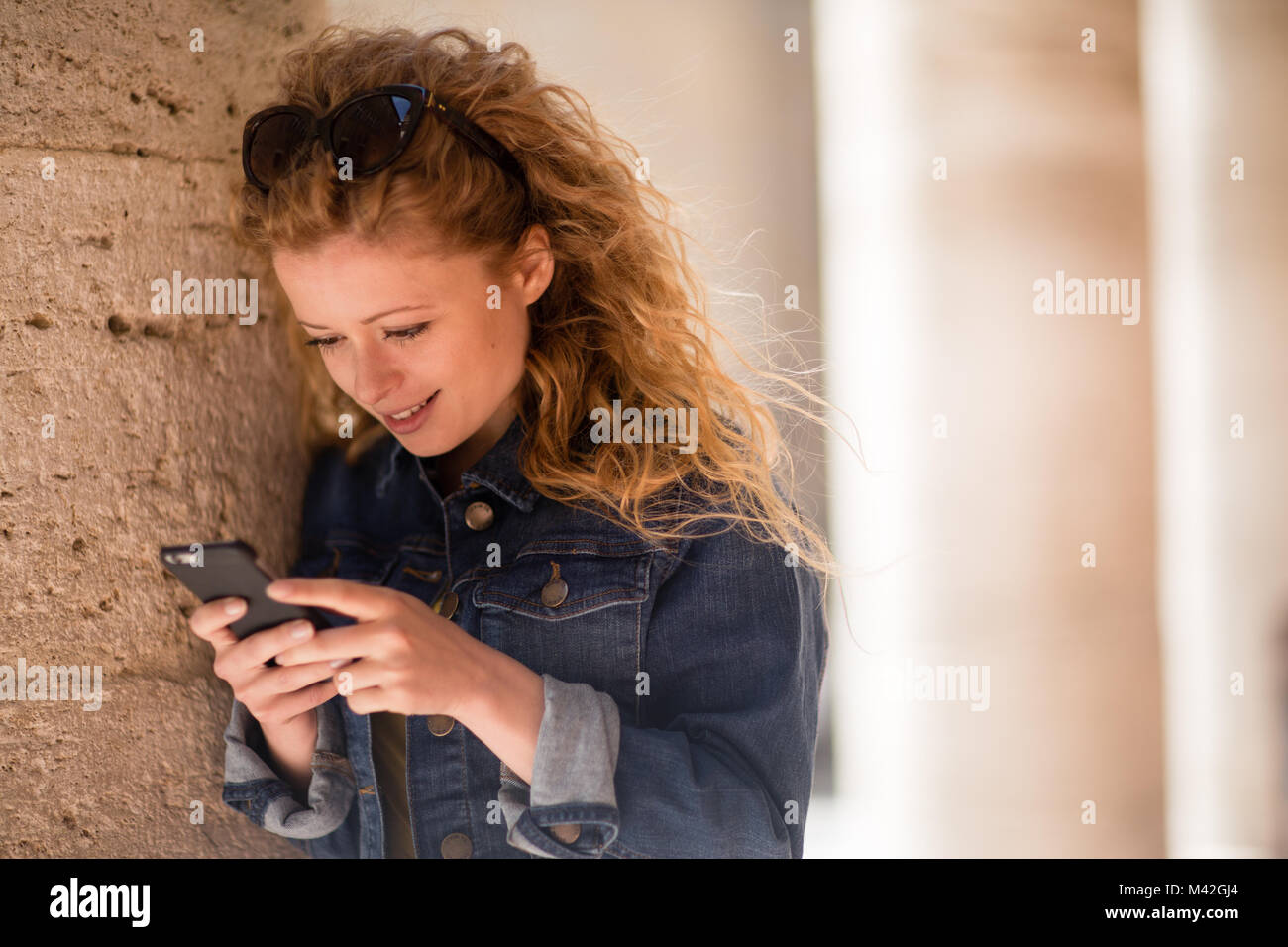 Tourist looking at smartphone Stock Photo